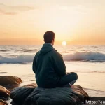 해양 생태계에서의 자연 명상 체험 - A serene coastal scene at dawn featuring a person sitting cross-legged on a smooth rocky shore, eyes...