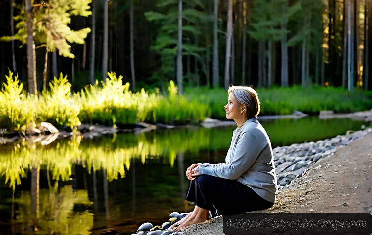 자연 명상과 정체성 회복의 연결 - Photorealistic wide shot of a middle-aged woman sitting quietly on a smooth riverside stone in a pea...